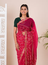 Ared and pink bandhani style saree with gotapatti embellishments and a mangal patha design