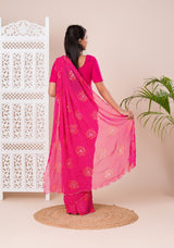 A pink saree with bandhani pattern and aari tari work