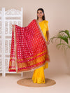 A traditional Rajasthani Bandhani Chunri Piliya Dupatta in red and yellow with a floral pattern