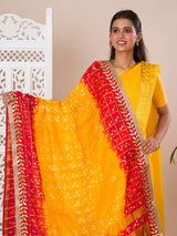 A traditional Rajasthani Bandhani Chunri dupatta in yellow and red with a gotapatti border, paired with a matching gharchola silk pomcha.