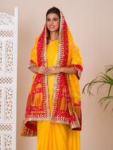 A traditional Rajasthani Bandhani Chunri dupatta in yellow and red with a gotapatti border, paired with a matching gharchola silk pomcha.