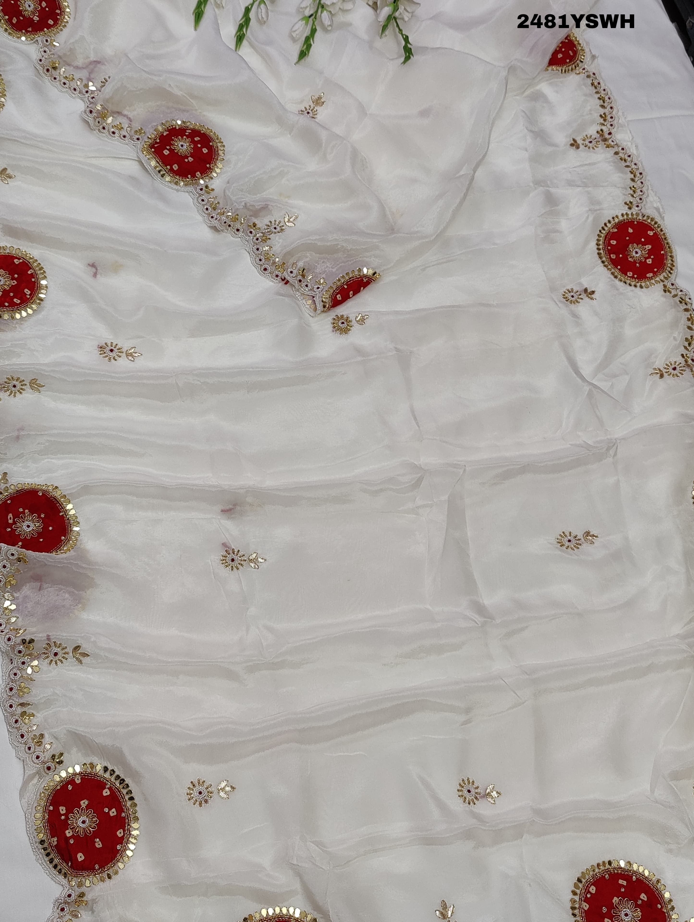 White chinon silk saree with red cutdana mirror work and white beads