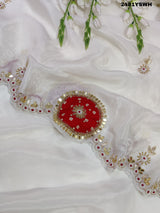 White chinon silk saree with red cutdana mirror work and white beads