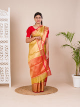 A Banarasi style saree in yellow and red with a tissue silk pattern, suitable for festival wear.