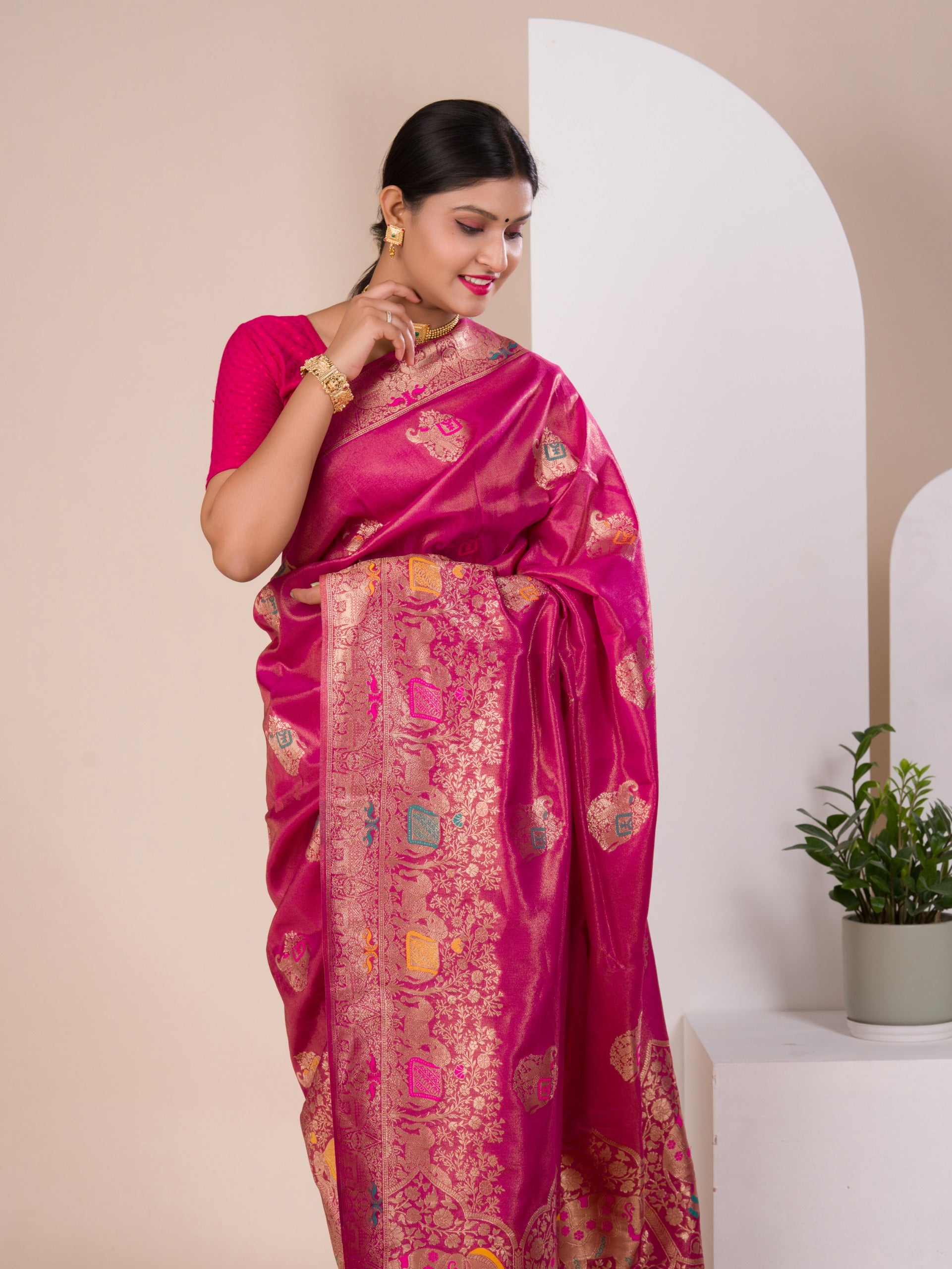 A pink Banarasi style saree with Meenakari weaving, 
