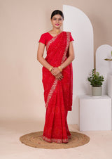 A red chiffon saree with bandhani pattern 