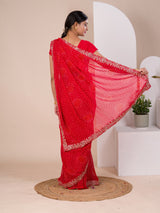 A red chiffon saree with bandhani pattern 
