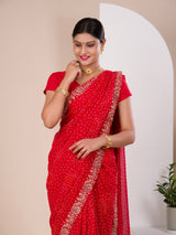 A red chiffon saree with bandhani pattern 