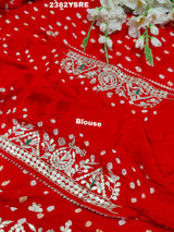 A red saree with white bandhani (dot) pattern and gotapatti border, 
