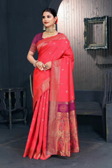 A red and pink Banarasi Dola silk saree with zari print, suitable for festive wear.
