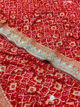 Neemzari Bandhej saree in traditional red color