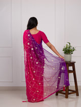 A pink and purple saree with a white pattern under 1000
