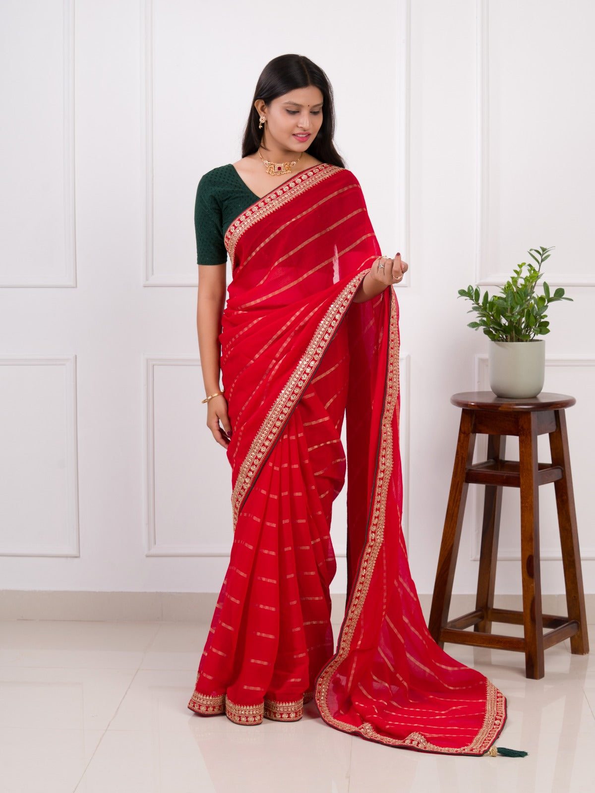 Red saree with gold border