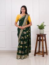 A green Dola silk saree with multi-colored bandhani style and Zari weaving work