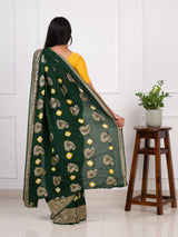 A green Dola silk saree with multi-colored bandhani style and Zari weaving work
