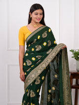 A green Dola silk saree with multi-colored bandhani style and Zari weaving work