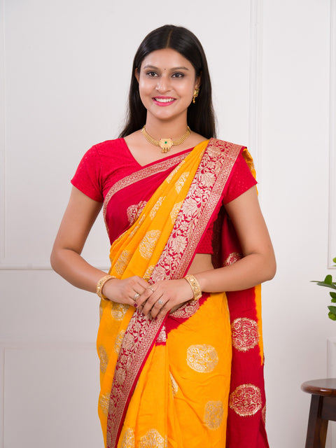 A yellow and red saree with  Pure Georgette Zari Faag Shadded Saree