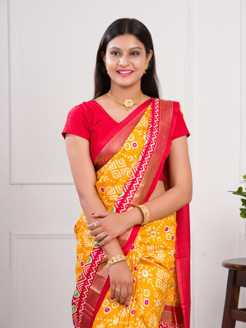 A yellow and red pashmina cotton silk saree with a patola style pattern 