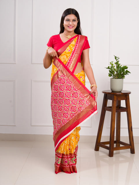  A yellow and red pashmina cotton silk saree with a patola style pattern 