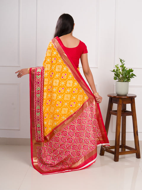  A yellow and red pashmina cotton silk saree with a patola style pattern 