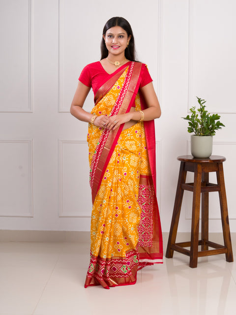  A yellow and red pashmina cotton silk saree with a patola style pattern 