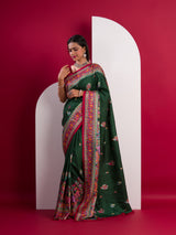 A green saree with a colorful borderin Dola Silk KalamkariStyle