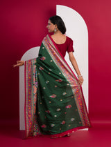 A green saree with a colorful borderin Dola Silk KalamkariStyle