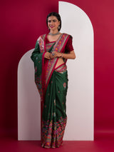A green saree with a colorful borderin Dola Silk KalamkariStyle