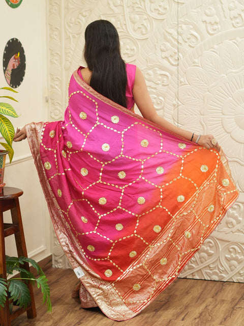 A pink and orange saree with Gota Patti Work