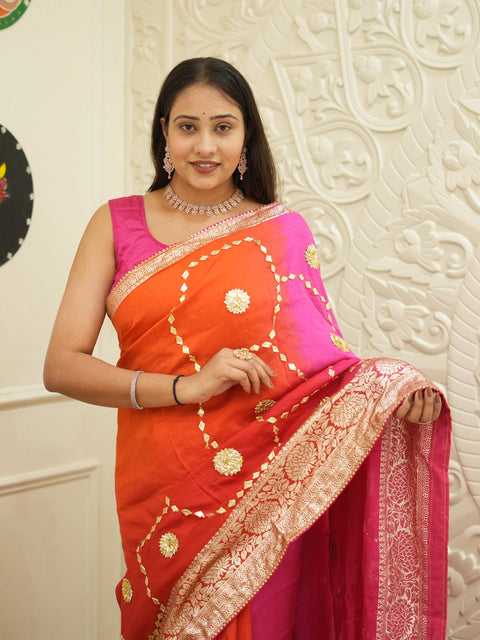 A pink and orange saree with Gota Patti Work