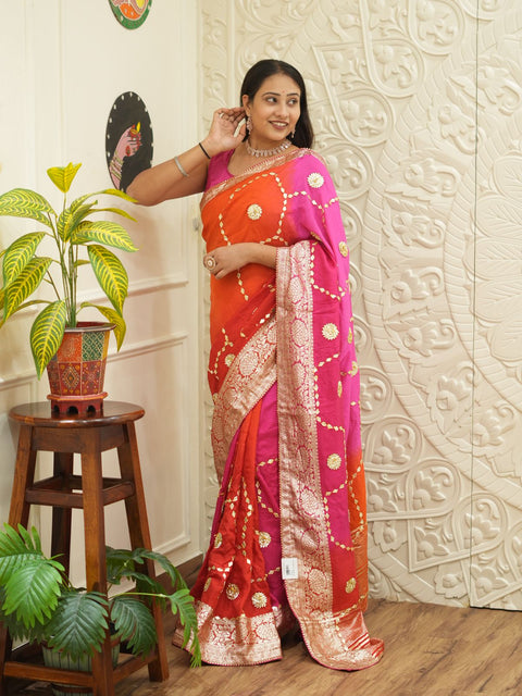 A pink and orange saree with Gota Patti Work