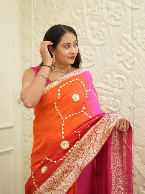 A pink and orange saree with Gota Patti Work