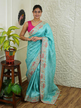 By sea green Banarasi silk saree with sequence embroidery work in a floral pattern 