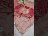 A saree with tissue silk fabric featuring Bollywood style embellishments and gotapatti work in red and pink colour