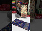  off-white saree with a floral and geometric pattern, featuring a heavy border and a small floral design on the fabric.