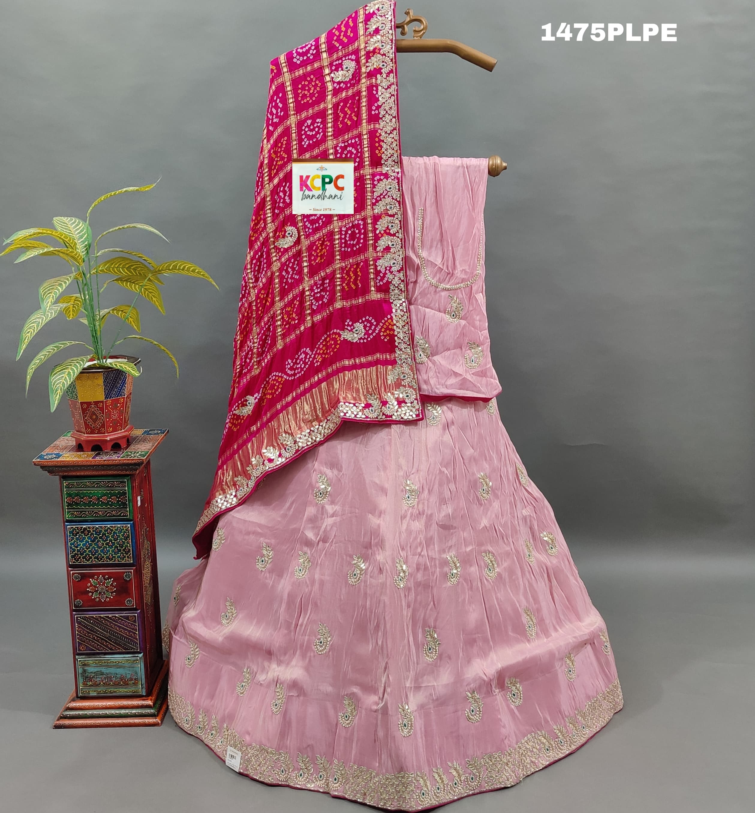 A pink silk lehenga with dupatta and gota patti work 