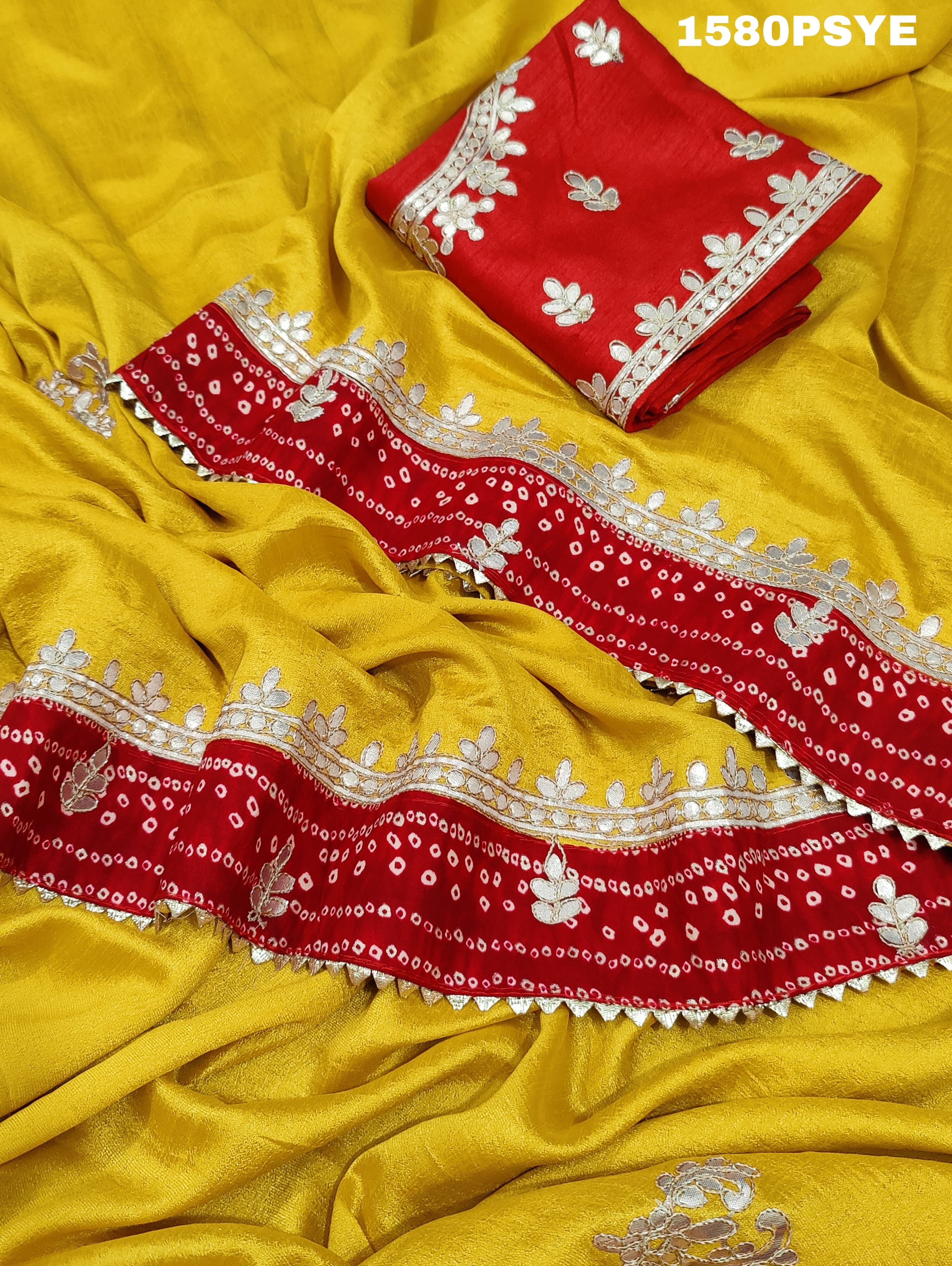 A yellow and red saree with gota patti work 