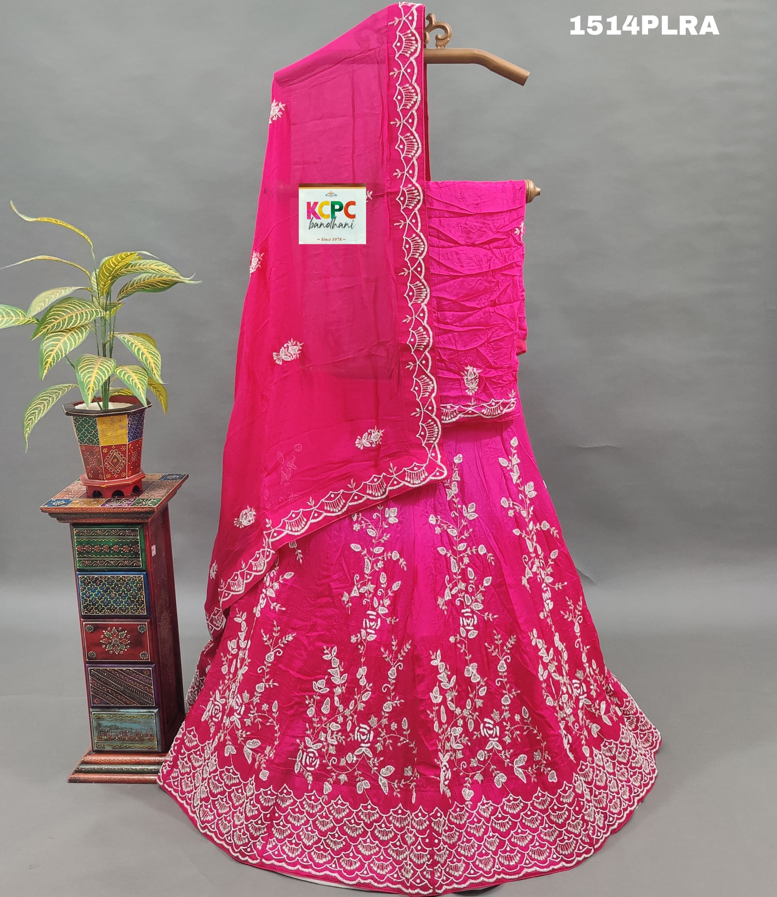 A pink lehenga with white cutdana beads work and mirror 