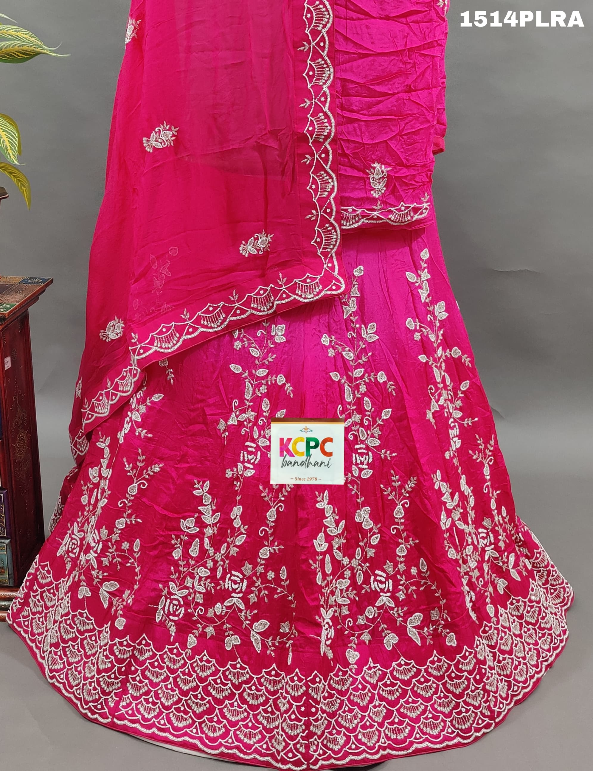 A pink lehenga with white cutdana beads work and mirror 