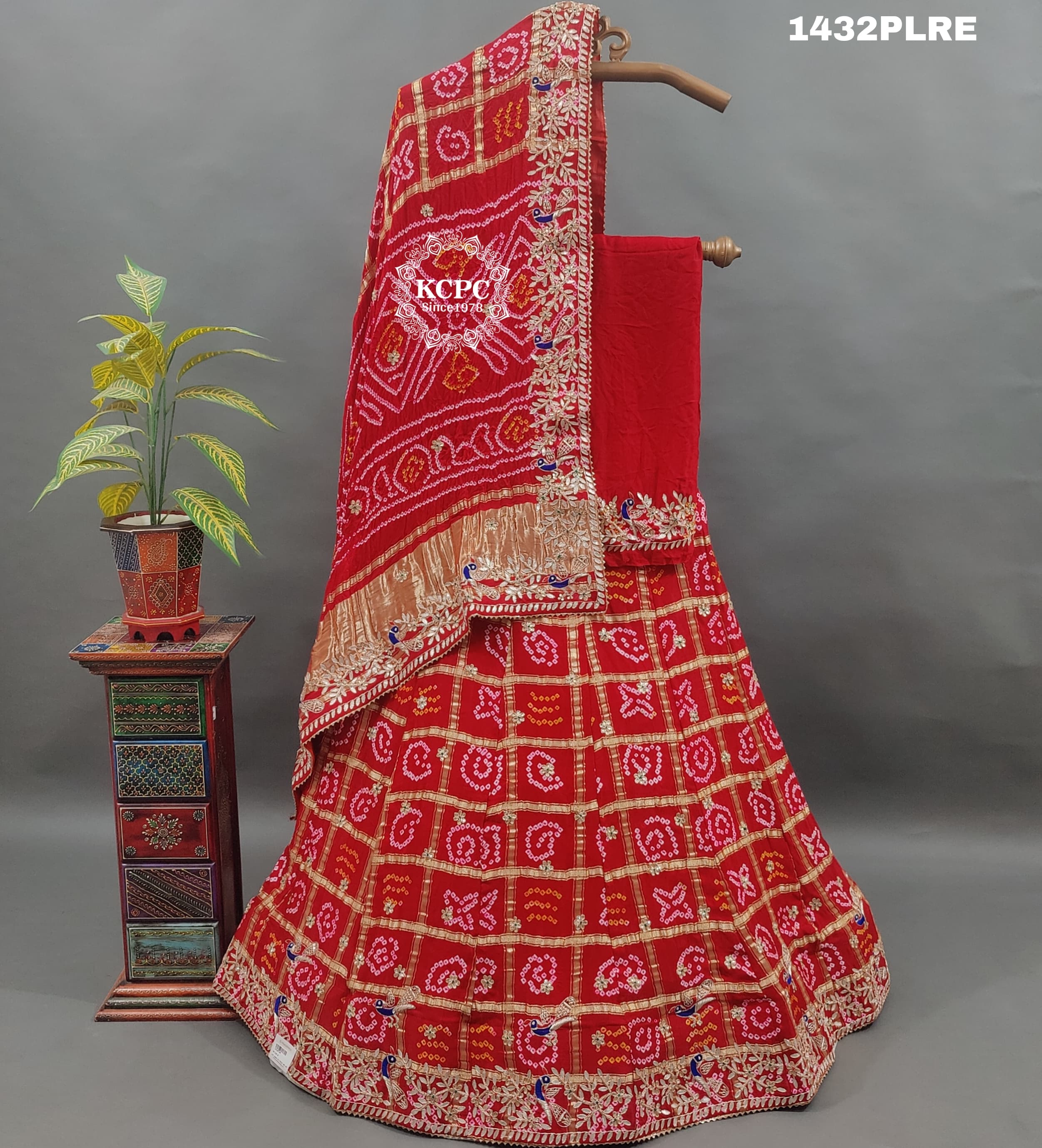 A red and multicolor traditional Gaji silk lehenga with zardozi work