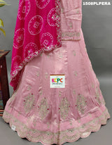 A pink silk lehenga with dupatta and cutdana work