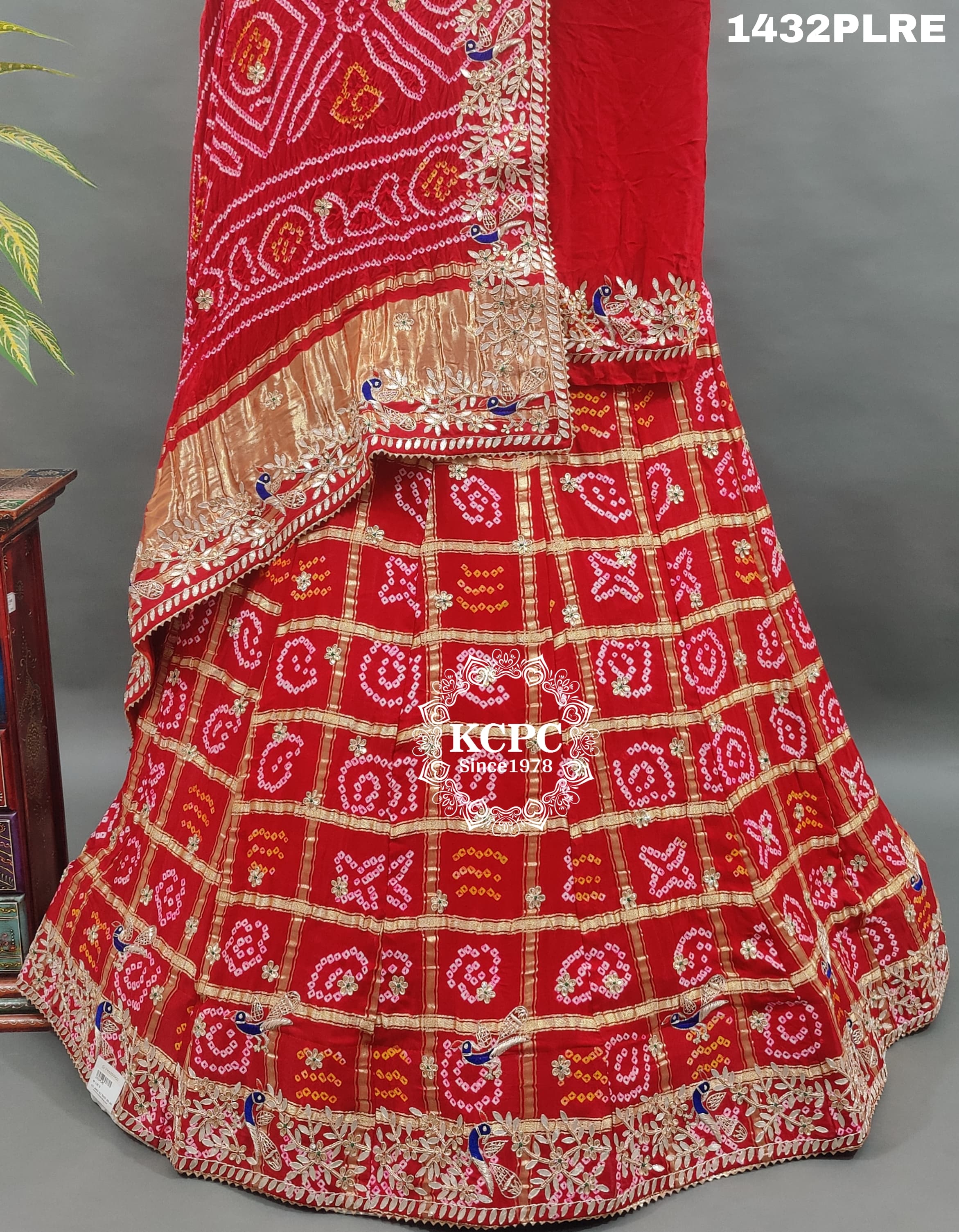 A red and multicolor traditional Gaji silk lehenga with zardozi work