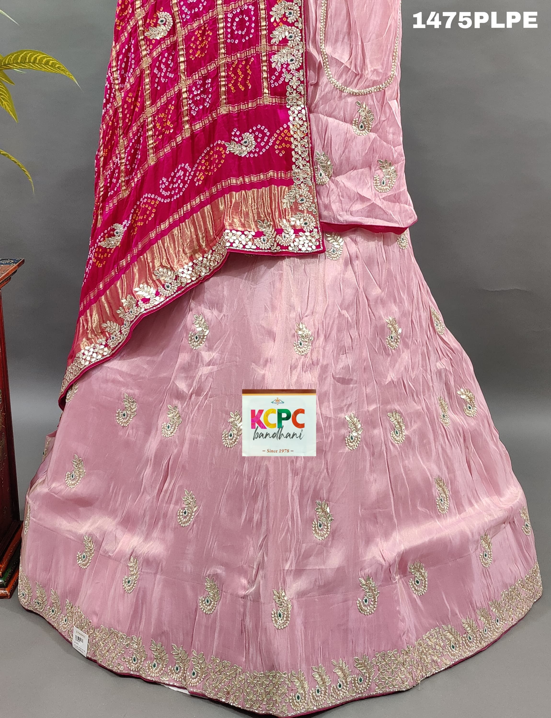 A pink silk lehenga with dupatta and gota patti work 